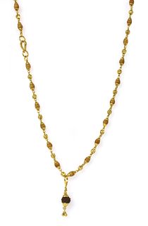 An Indian high carat gold Rudrasksh pendant,