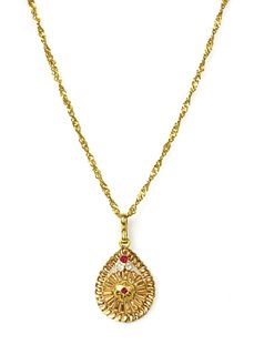 An Indian high carat gold paste pendant,