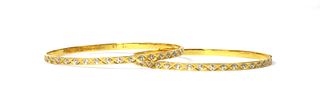 A pair of Indian high carat gold bangles,