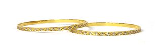 A pair of Indian high carat gold bangles,