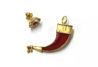 An Indian high carat gold pendant,