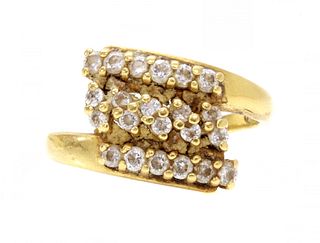 An Indian high carat gold cubic zirconia crossover ring,