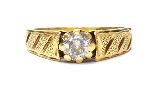 A 22ct gold single stone paste set ring,