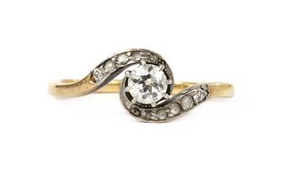 A gold diamond crossover ring,