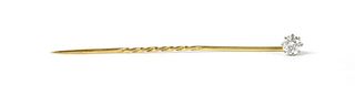 A gold single stone diamond stick pin,