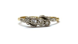 A gold four stone diamond ring,
