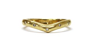 An 18ct gold diamond set wishbone ring,