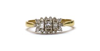 An 18ct gold three stone diamond cluster ring,