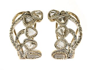A pair of gold lasque cut diamond earrings,