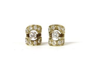 A pair of gold diamond stud earrings,