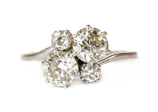 A white gold four stone diamond cluster ring,