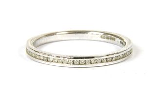 A 9ct white gold diamond set half eternity ring,