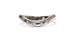An 18ct white gold diamond set shaped band ring,