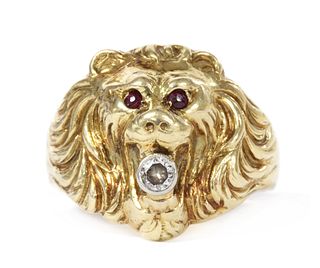 A gold lion head ring,