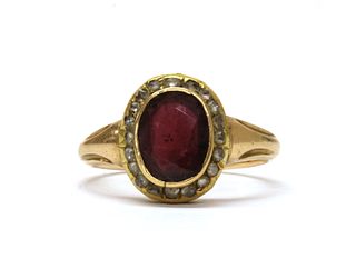 A gold garnet and diamond cluster ring,