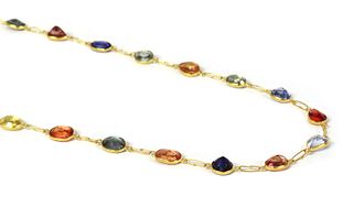 A gold varicoloured sapphire rivi?re necklace,
