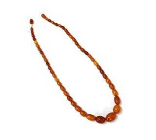 A single row graduated butterscotch amber bead necklace,