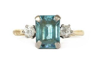 A gold blue zircon and diamond three stone ring,