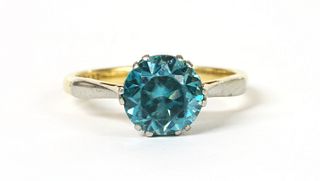A gold single stone blue zircon ring,