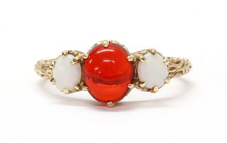 A 9ct gold three stone opal ring, by E W Adams,