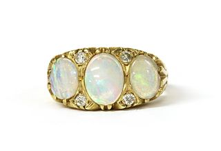 An 18ct gold opal and diamond ring,