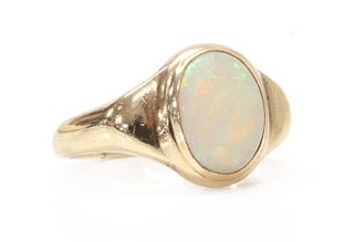 A gold single stone opal ring,