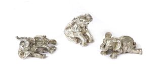 A set of three silver sculptures of elephants playing, by Patrick Mavros,
