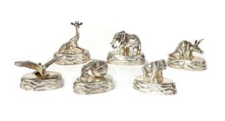A set of six solid animal silver place card holders, by Patrick Mavros,