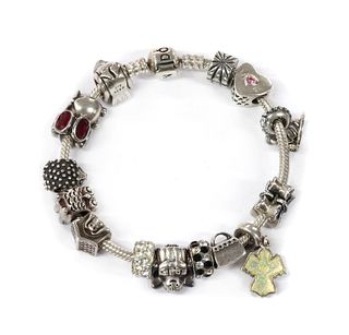 A sterling silver Pandora bracelet,