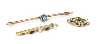 A gold ruby and seed pearl bar brooch,