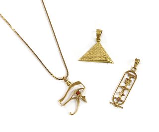 An Egyptian gold pyramid pendant,