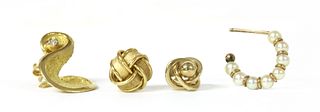 Four single gold earrings,