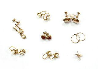Eight pairs of gold earrings,