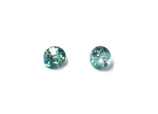 A pair of unmounted old brilliant cut blue zircons,