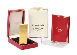 A cased Must de Cartier gold plated gas lighter,