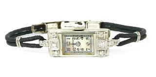 An Art Deco Canadian ladies' white gold diamond set cocktail watch, by Birks,