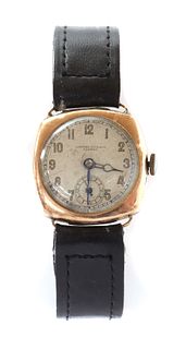 A mid-size 9ct gold mechanical strap watch,