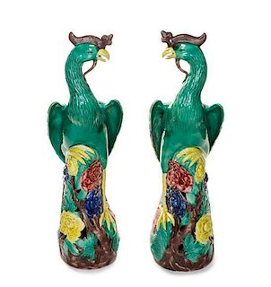 * A Pair of Chinese Export Polychrome Enameled Figures of Phoenix, Height 15 3/4 inches.