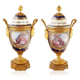PAIR OF  19TH CENTURY SEVRES-STYLE PORCELAIN COVERED AND ORMOLU MOUNTED URNS