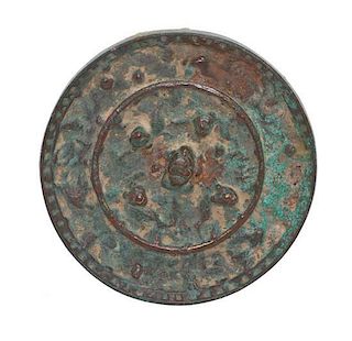 A Chinese Bronze Disc Mirror, Diameter 4 1/8 inches.