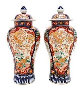 A Pair of Imari Porcelain Urns and Covers, Height 13 1/2 inches.