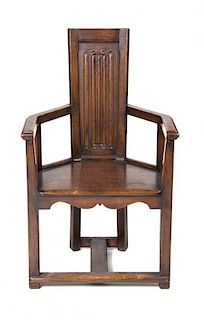 * A Gothic Revival Oak Open Armchair, Height 40 1/4 inches.