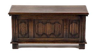 A Gothic Revival Oak Chest, Height 18 1/2 x width 37 1/2 x depth 15 inches.
