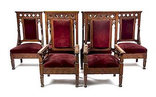 A Set of Eight Gothic Revival Oak Chairs, Height of armchairs 50 1/2 inches.
