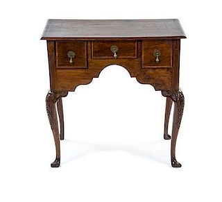 A George I Style Walnut Lowboy, 18TH CENTURY, THE TOP REPLACED, Height 28 1/2 x width 29 1/2 x depth 19 1/2 inches.