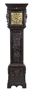 * An English Carved Oak Tall Case Clock, PARKINSON, LANCASTER, Height 80 3/4 inches.