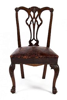 A Set of Six Irish Chippendale Style Dining Chairs, Height 38 1/2 inches.