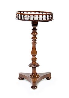 An Irish Yew Wood Candle Stand, LATE 18TH/EARLY 19TH CENTURY, Height 31 x diameter of top 15 1/2 inches.