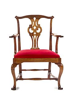 * A Chippendale Style Mahogany Armchair, 19TH CENTURY, Height 38 inches.