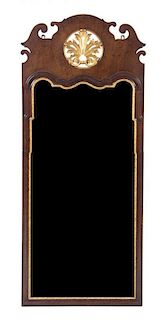 A Chippendale Style Parcel Gilt Mirror, Height 58 x width 24 inches.